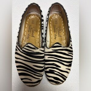 Sabah Safari pony calf hair flats with a zebra print pattern. Women’s Size 40 EU
